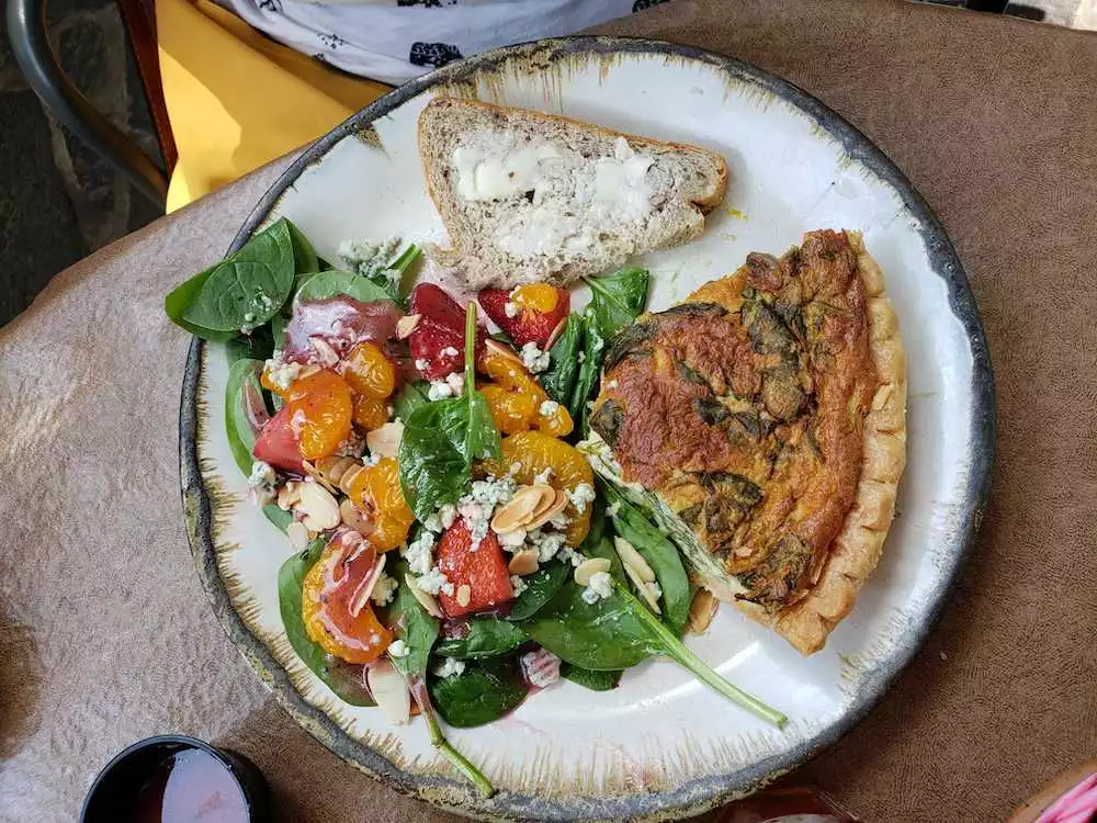 spinach and mushroom quiche with strawberry spinach salad