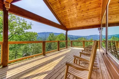 cabin deck with a mountain view