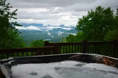 cabin hot tub overlooking mountain view