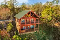 fall trees surrounding cabin by dollywood in pigeon forge