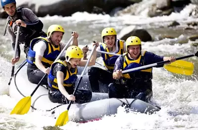 group of people whitewater rafting