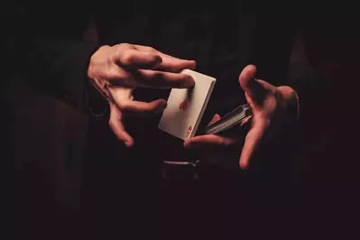 person doing a card trick