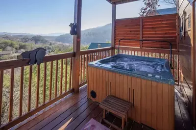 hot tub on deck of 3 bedroom cabin