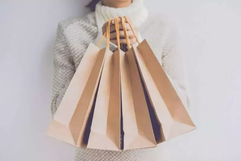 woman holding shopping bags