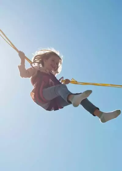 Young girl bungee jumping at The Island in Pigeon Forge Tn