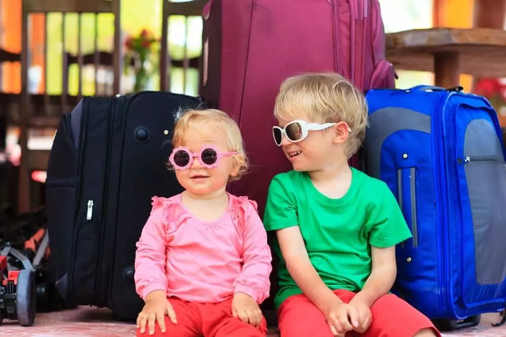 A toddler and her older brother on vacation.