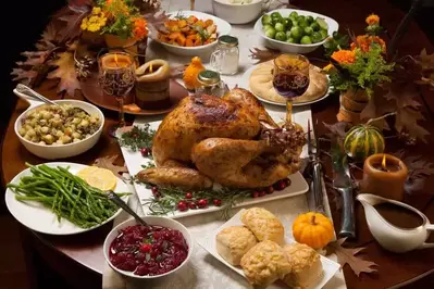 A table filled with tasty Thanksgiving food.