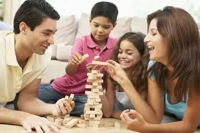 Family playing Jenga