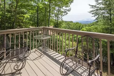 Chairs on the deck of the Alpine Lovers Penthouse cabin in Pigeon Forge.