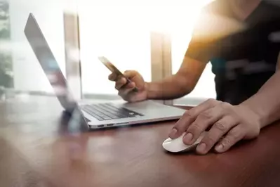 A man using a laptop.