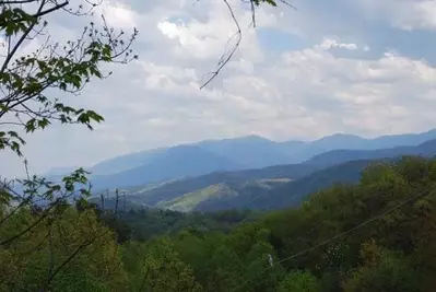 Beautiful photo of the mountains taken from the Alpine Lovers Penthouse cabin.