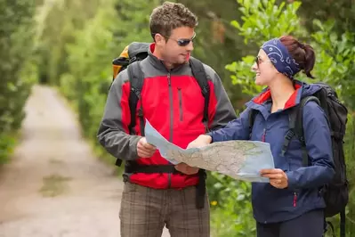 Couple hiking at Couple celebrating honeymoon at secluded Pigeon Forge honeymoon cabin