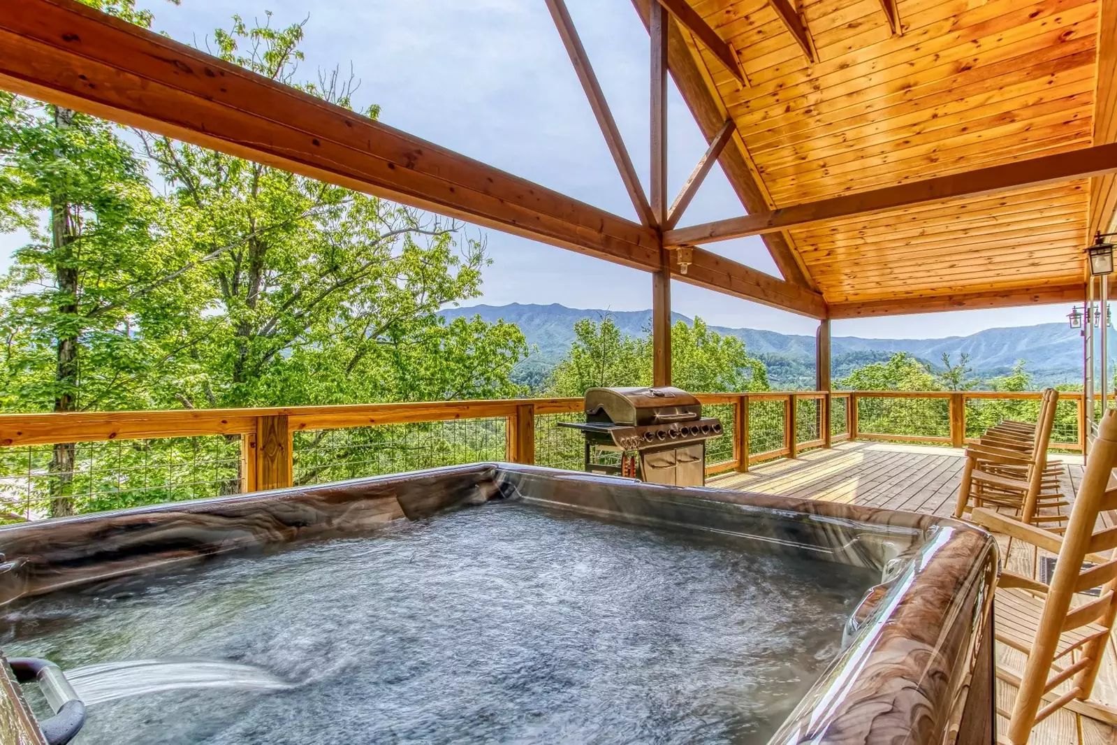 Hot tub and grill on cabin deck