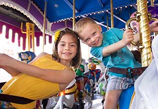 Kids riding a carousel at Dollywood.