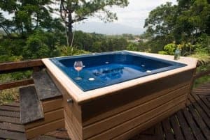 outdoor hot tub at a log cabin rental in Pigeon Forge TN