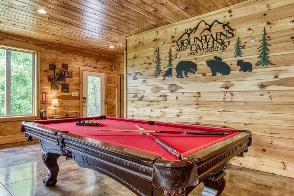 cabin in gatlinburg tn called deerfoot lodge with a pool table in the game room