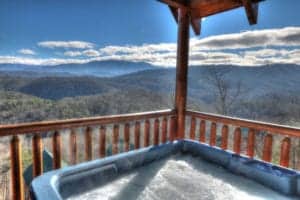 Hot tub on the deck of Changes in Latitude, one of our cabins with mountain views in Pigeon Forge.