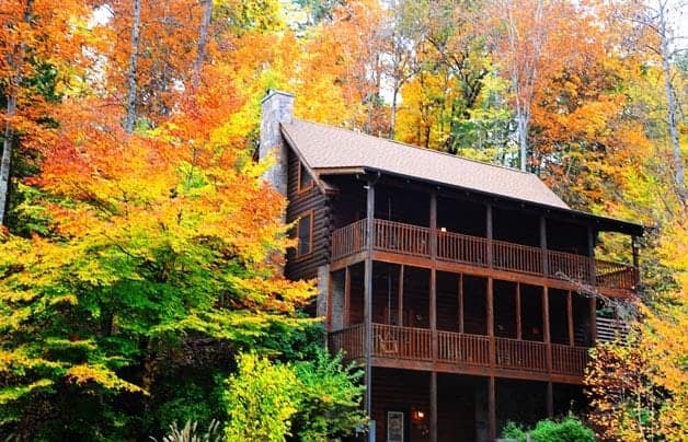 The Renewed Spirit cabin surrounded by fall foliage in the Smoky Mountains.
