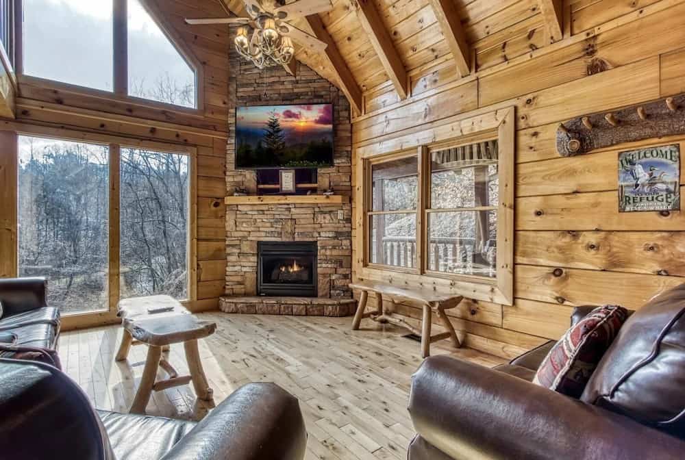 living room of cabin with snowy winter views