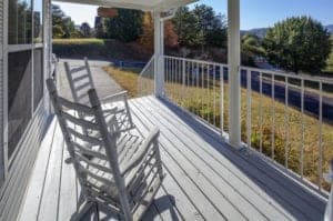 front porch sweater with white rocking chairs