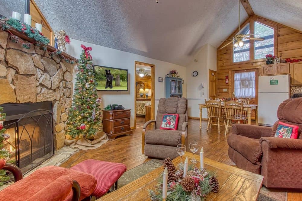 living room of cabin with Christmas tree